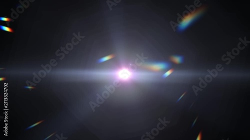 Bright light bursts against deep black space. Rainbow streaks scatter across the frame
