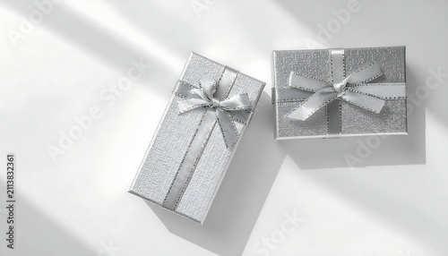 Elegant Silver Gift Boxes with Glitter and Ribbons on White Background