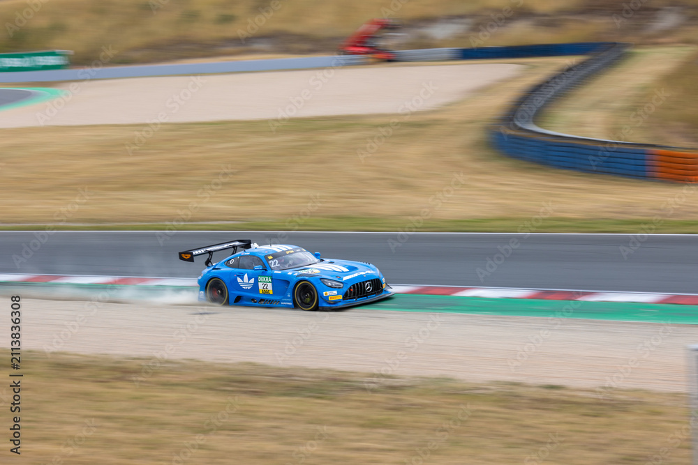 Obraz premium Oschersleben, Germany. 26th July 2026. Lucas Auer runs wide in blue number 22 Mercedes-AMG GT3 from Team Landgraf at Motorsport Arena Oschersleben during DTM 2026 race.