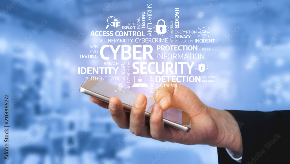 Obraz premium A close-up of a hand holding a smartphone amid a visual representation of cyber security terms, conveying the importance of protecting digital identities and data privacy. Tessel