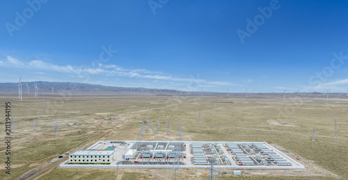 Aerial View of Energy Storage Pwer Station in Arid Grassland with Wind Turbines