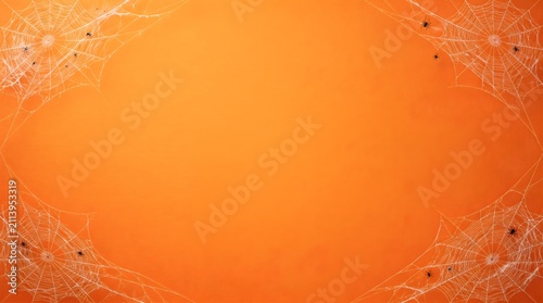 Orange Halloween background with spider webs. Spooky festive backdrop for holiday design.