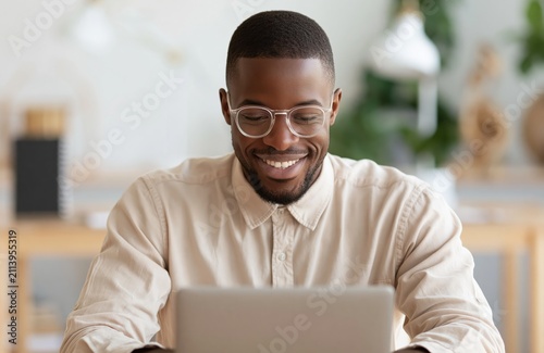 Man professional person typing on laptop as an african business entrepreneur worker