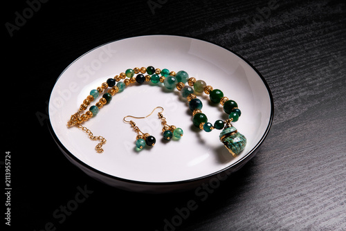 Obraz na plátne Luxury Jewelry Served in White Bowl Symbolizing Consumerism Wealth and Desire