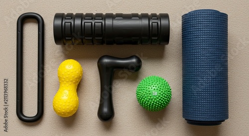 Yoga and Fitness Accessories Laid Out on Beige Surface