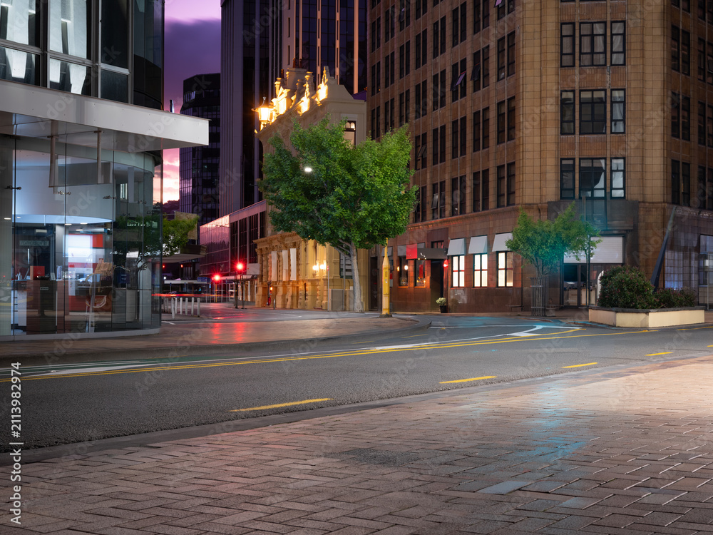 Fototapeta premium Car background, automotive backplate, central business district road at night
