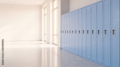 Bright and empty school hallway with a long row of light blue lockers and sunlit windows.