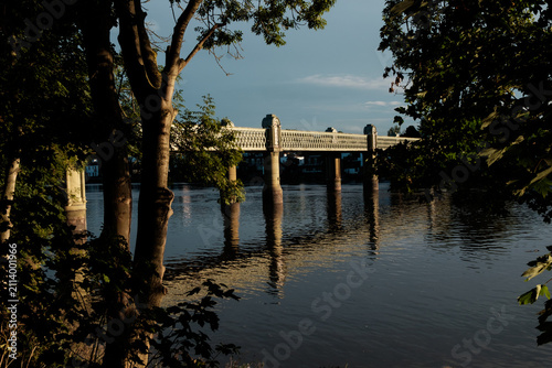Photography Fulham railway bridge arching over river thames at sunset