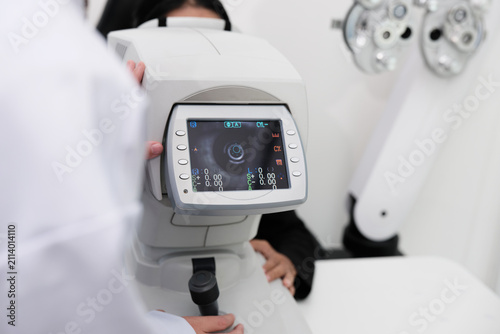 Close-up, refractometer device screen, patient eye exam, vision and eyesight improvement by expert optometrist, diagnostic for eyeglasses lens, professional technology services in optical clinic.