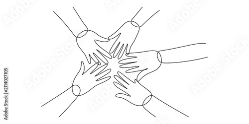 Group of people hands reaching to the center as a team