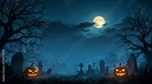 Spooky graveyard under a full moon with glowing pumpkins on Halloween night