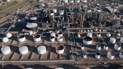 Aerial view of oil refinery with storage tanks and industrial infrastructure 
