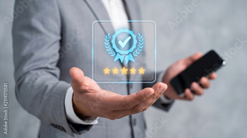 Businessman presenting digital 5-star rating and quality certification badge