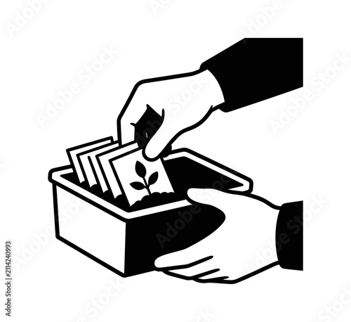 Hand holding a plant seedling marker inside a garden planter box black icon graphic