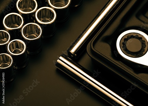 Shiny metal socket set and ratchet tool laid out for use