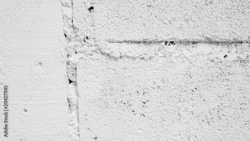 Close up white stucco concrete wall texture with rough painted surface