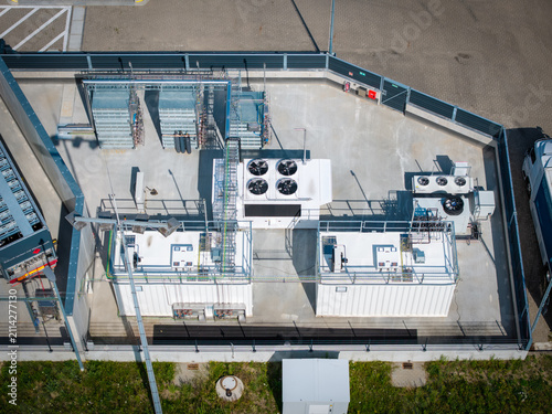Aerial view of a modern hydrogen refueling station (H2 station) in an industrial logistics area.