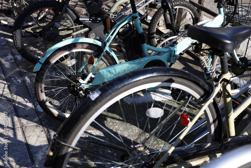 Canvastavla Close-up of bicycles parked in a row at an outdoor bike rack.