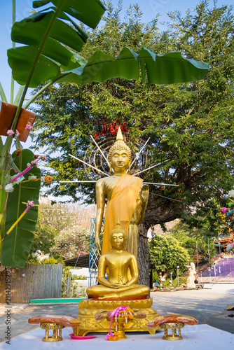 Golden Statues of Buddha in Outdoor Shrine
