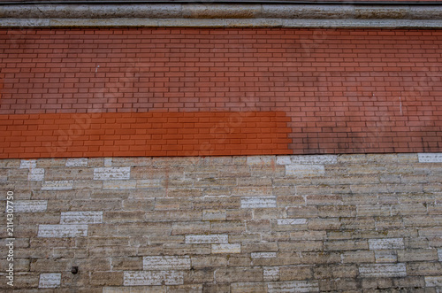 A wall of stone and brick in close-up.