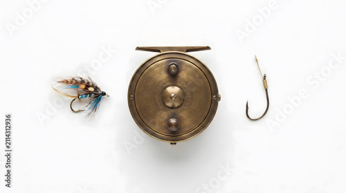 Antique fishing reel with lure and hook