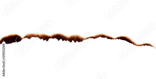 Burnt paper edge with dark scorch marks and curved burned shape