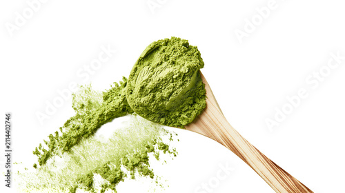 Wooden spoon with green matcha powder spilled