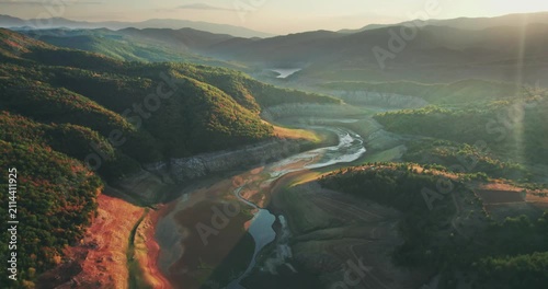 Draught Empty Riverbed Lake Dam at Sunset Aerial View