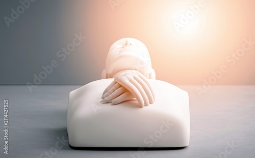A lifelike dummy with crossed hands rests on a surface, bathed in warm light