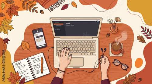 Overhead view of hands typing on a laptop with a notebook, phone, and coffee cup arranged on a desk during autumn, conveying cozy work