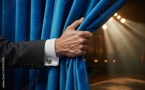 Cinematic Businessman Hand Pulling Blue Theater Curtain Spotlight Reveal Photo