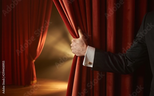 Businessman Hand Opening Red Stage Curtain Spotlight Background Image
