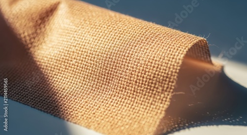 Close-up macro shot of textured burlap fabric with detailed weave and soft natural lighting creating shadows