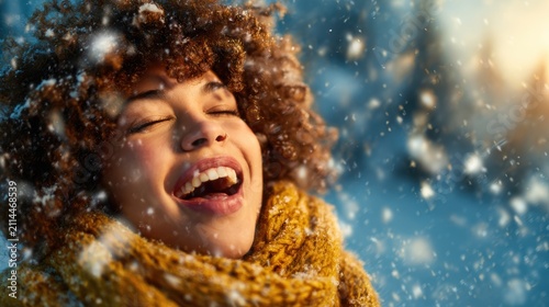 A joyful woman with curly hair experiences the beauty of snowfall, exuding happiness and warmth with her vibrant scarf and glowing smile against a wintery backdrop.