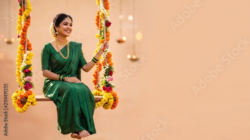 A happy Indian woman dressed in a traditional green saree sitting on a floral decorated swing, celebrating the Teej festival with grace, elegance, and a warm smile in a festive atmosphere.