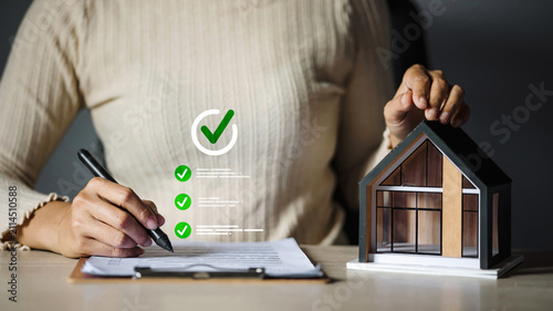 Real Estate Agent Holding House Model and Signing Approved Mortgage Loan Contract