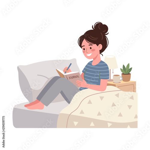 Young woman writing in journal while sitting on bed indoors  