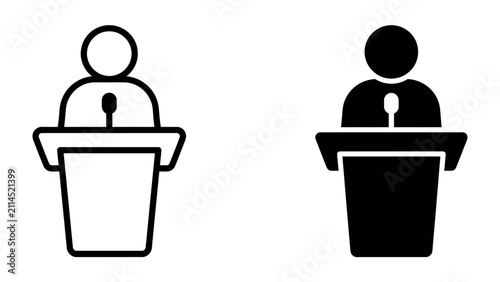 Фотография Public Speaker Icons: Two minimalist icons depict a speaker at a podium, one in outline and the other solid black, representing speech and presentation