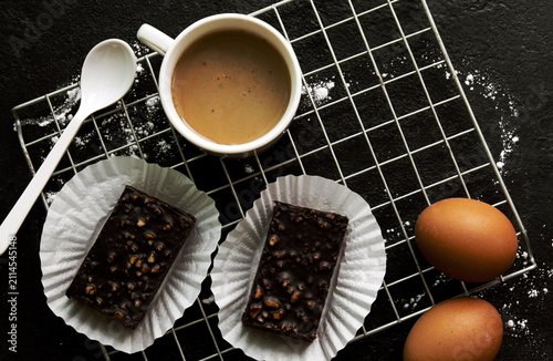 delicious homemade chocolate brownies  , arranged on wire cooling rack. Taken on a white background.