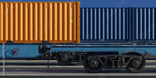 Foto Side profile of orange shipping container on intermodal rail wagon