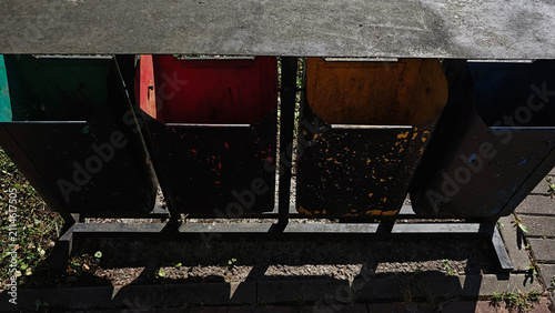 Canvastavla Four distinctively colored bins stand in a row, ready for waste segregation in a