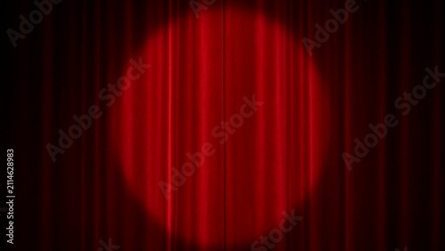 Fotografie Dramatic red theater curtain backdrop with a bright centered spotlight and velve