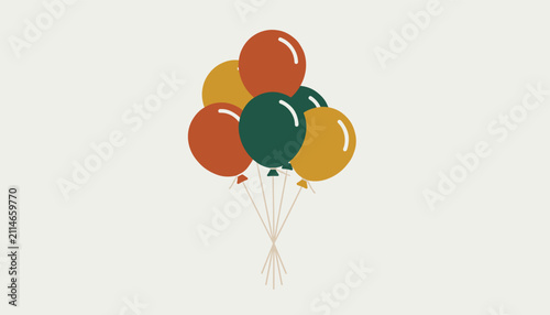 Festive bunch of helium balloons in warm autumn colors tied together with thin strings on a light background.