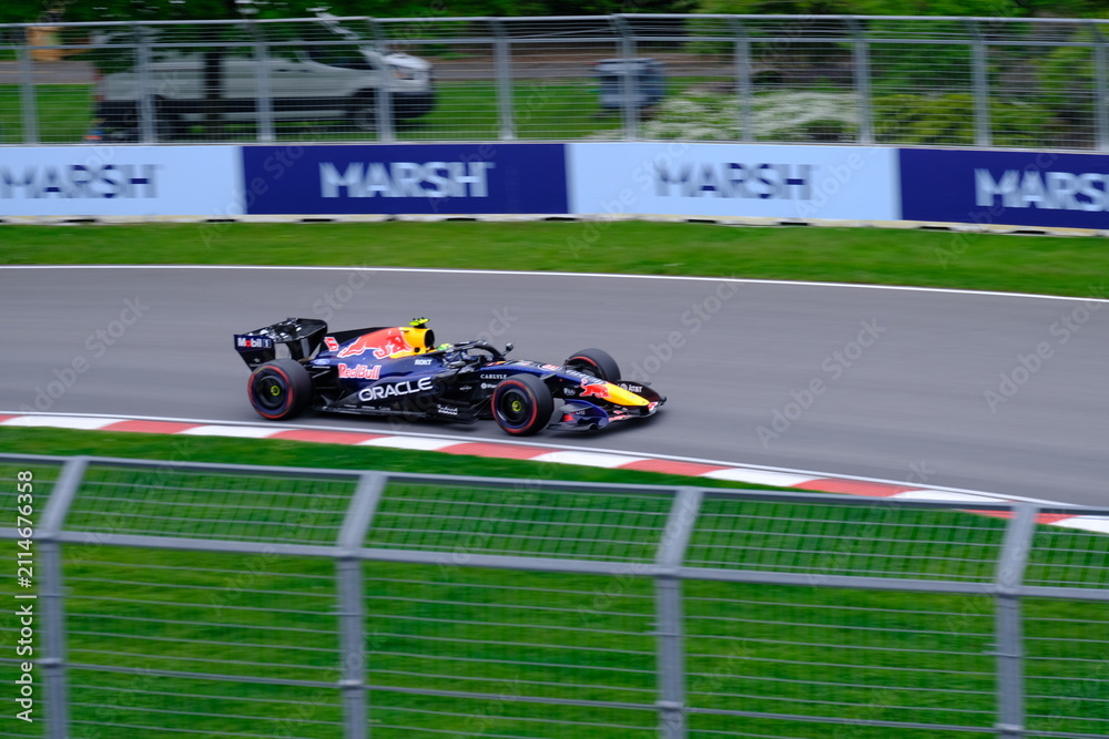 Fototapeta premium May 24, 2025, Montreal, Canada: Red Bull Racing Formula 1 car during by Hadjar or Verstappen, demonstration run at Circuit Gilles Villeneuve. g.