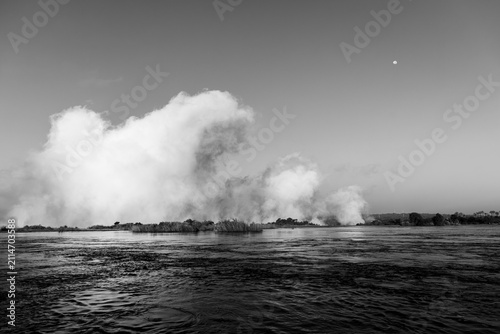 edge of the Zambezi River as it tumbles into Victoria Falls, from the Zambian side, Africa, portrayed in black and white