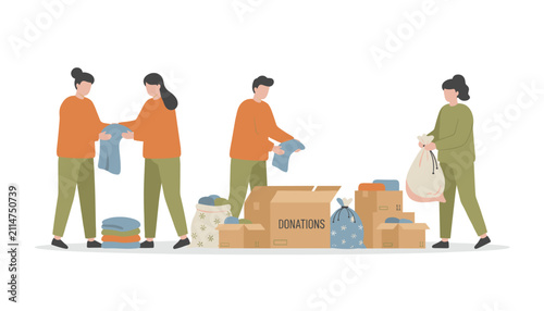 People sorting and packing used clothing items into cardboard boxes for charity donations, emphasizing support and communal recycling efforts.