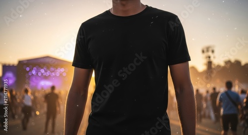Heroic Mockup of Person in Blank Black T Shirt at Sunset Music Festival Crowd