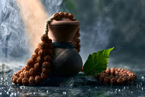 Traditional Wooden Damaru Drum with Rudraksha Mala and Bilva Leaf