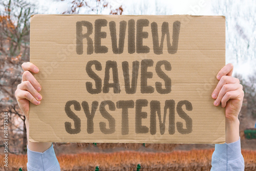 Foto "Review Saves Systems" Checking code regularly prevents catastrophic failures