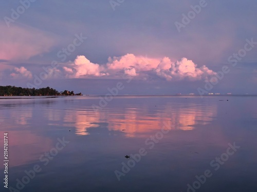 Bild auf Leinwand A pink sunrise at the beach in Kota Kinabalu, Malaysia.